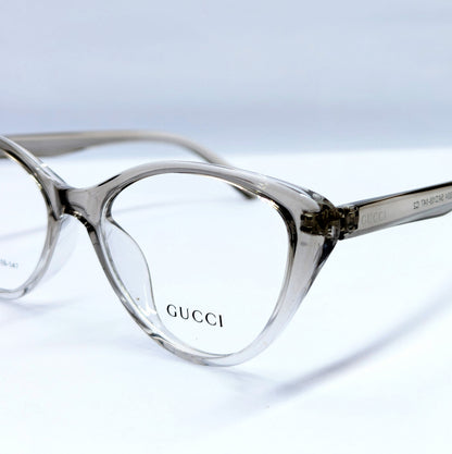 Gucci cat-eye eyeglasses in a translucent smoky gray acetate