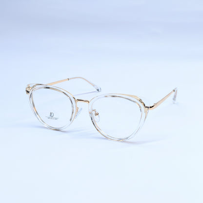 Oversized oval eyeglasses with a clear acetate frame and gold metal rims, displayed on a light blue gradient background.