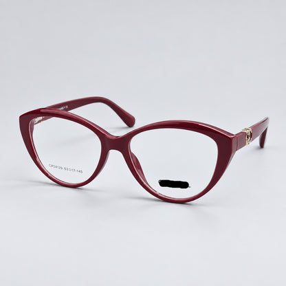 CHANEL Paris cat-eye eyeglasses in a translucent burgundy acetate, featuring gold metal hinges and the CHANEL logo on the lower right frame corner.