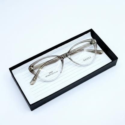 Gucci cat-eye eyeglasses in a translucent smoky gray acetate